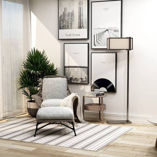 Corner Plant in a Minimalistic Room with Hanging Pictures